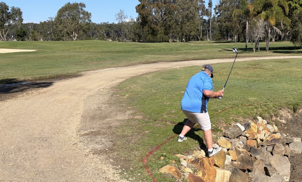 Do not try this at home, or at Nambucca golf course. Annette Hobday on the 5th. No one was injured, including the ball, as the staunch stance and swing found nothing but air.